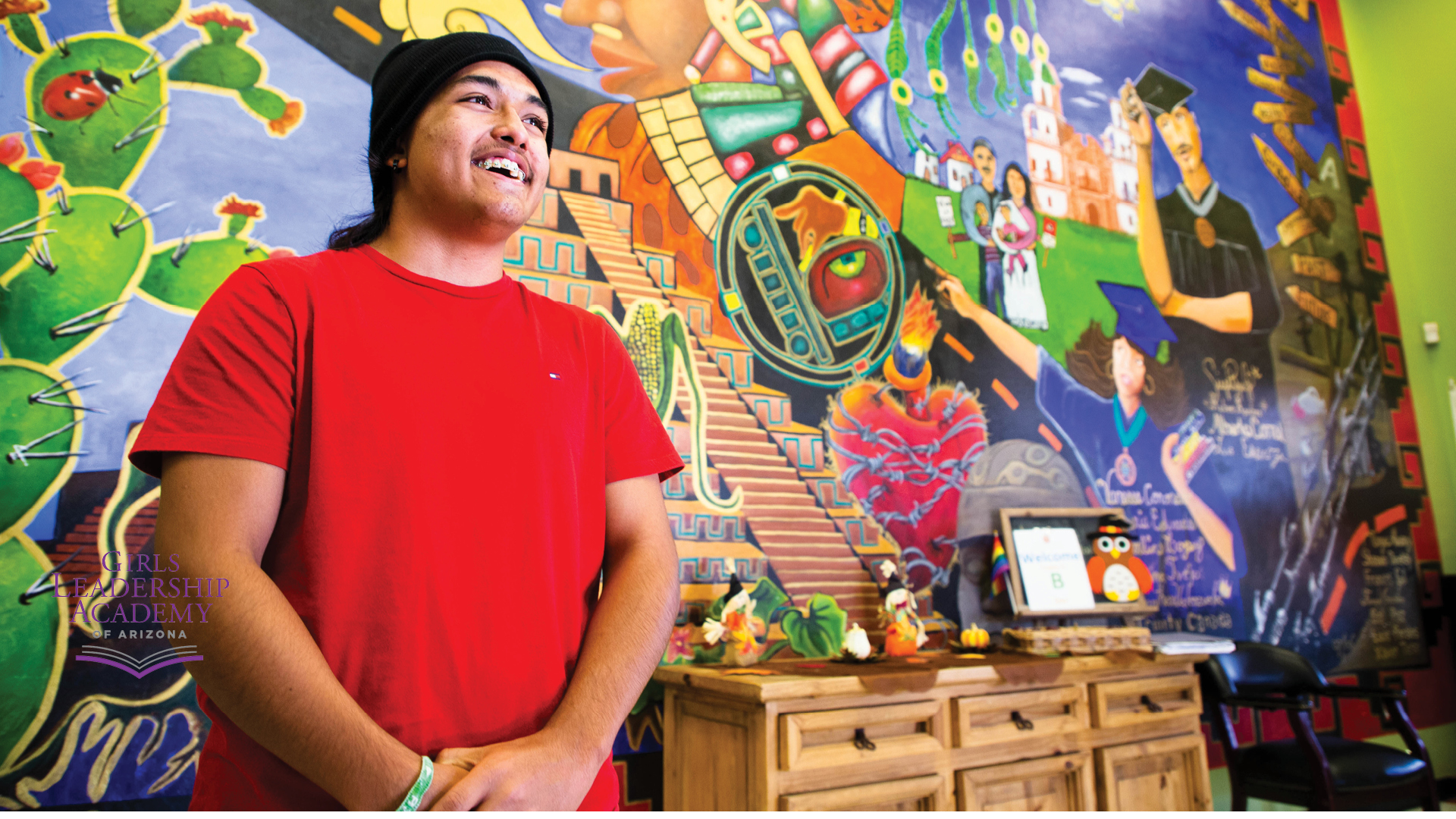 student with mural